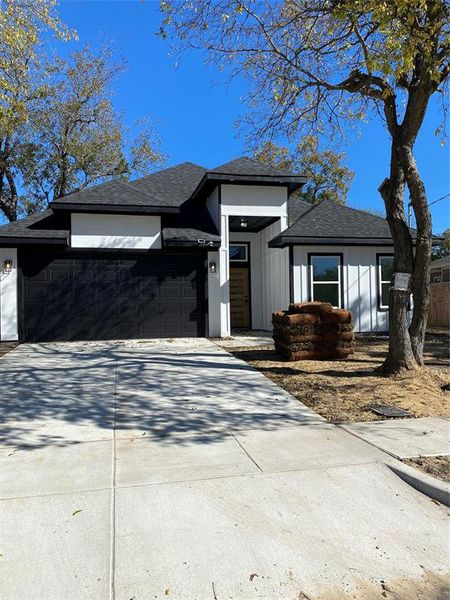 Prairie-style home with a garage