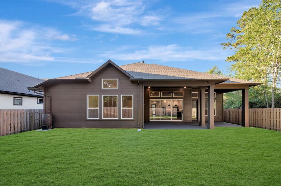 Large Outdoor living area overlooks a fully sodded and fenced rear yard w/full gutters and sprinklers!