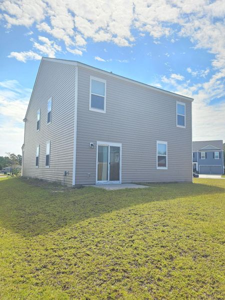 Front exterior of a new home in , Ladson, SC, highlighting curb appeal (Image 24).