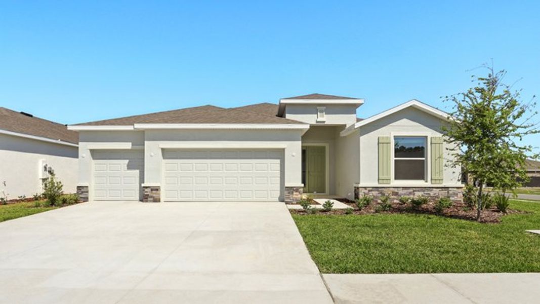Representative exterior photo of a completed home built from the Hawthorne by D.R. Horton in Twisted Oaks, Wildwood, FL (Image 1).