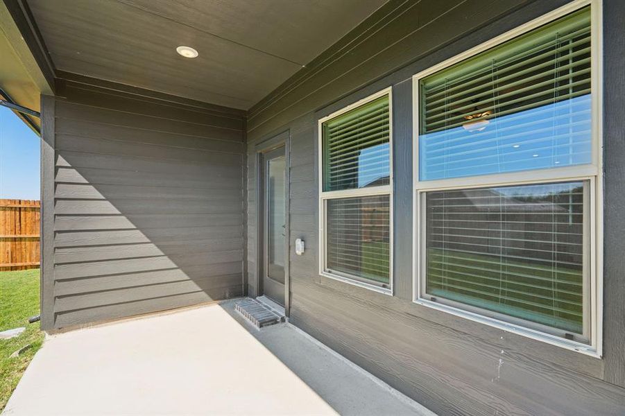 Exterior details and patio area of a home in Simpson Crossing - Spring Series, McKinney (Image 3). Exterior details and patio area of a home in Simpson Crossing - Spring Series, McKinney (Image 3).