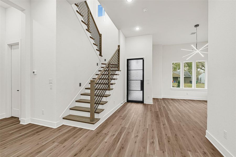 Grand entry leads to an open floor plan full of natural light and modern finishes. Pure Luxury Grand entry leads to an open floor plan full of natural light and modern finishes. Pure Luxury