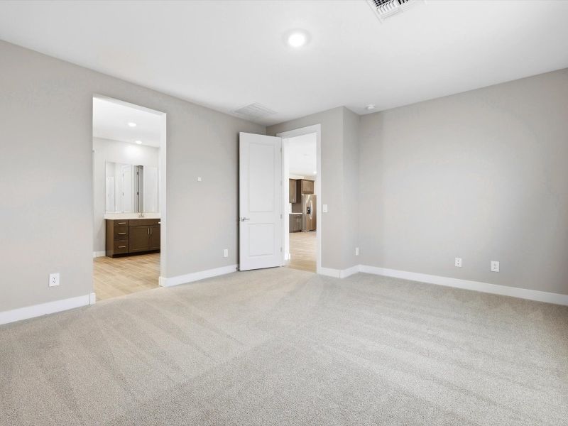 Spacious, unfurnished interior of a new home in White Tank Foothills Signature Series, Waddell (Image 10).