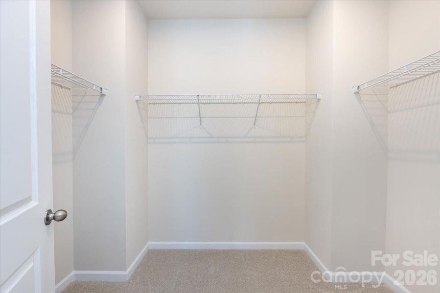 Primary Walk-In Closet Primary Walk-In Closet