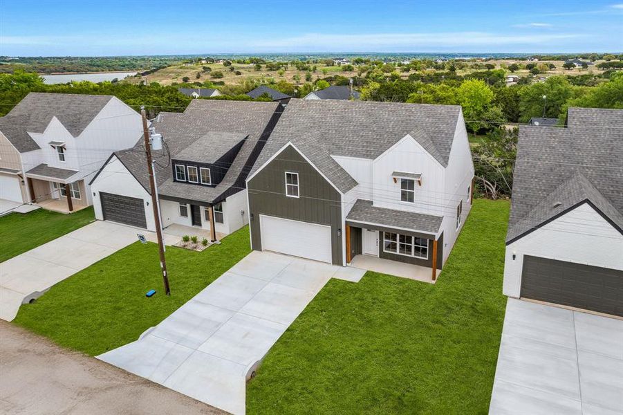 Front exterior of a new home in Canyon Creek, Granbury, TX, highlighting curb appeal (Image 20).