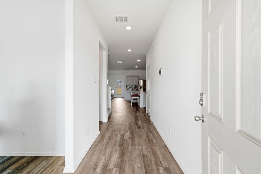 Bright, inviting entryway with polished finishes and a seamless flow into the home.