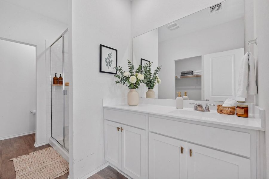 Clean lines and a spacious vanity highlight this modern bathroom design. Clean lines and a spacious vanity highlight this modern bathroom design.
