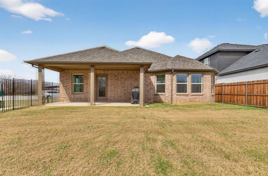 Exterior details and patio area of a home in Sagebrook, Denton (Image 23).