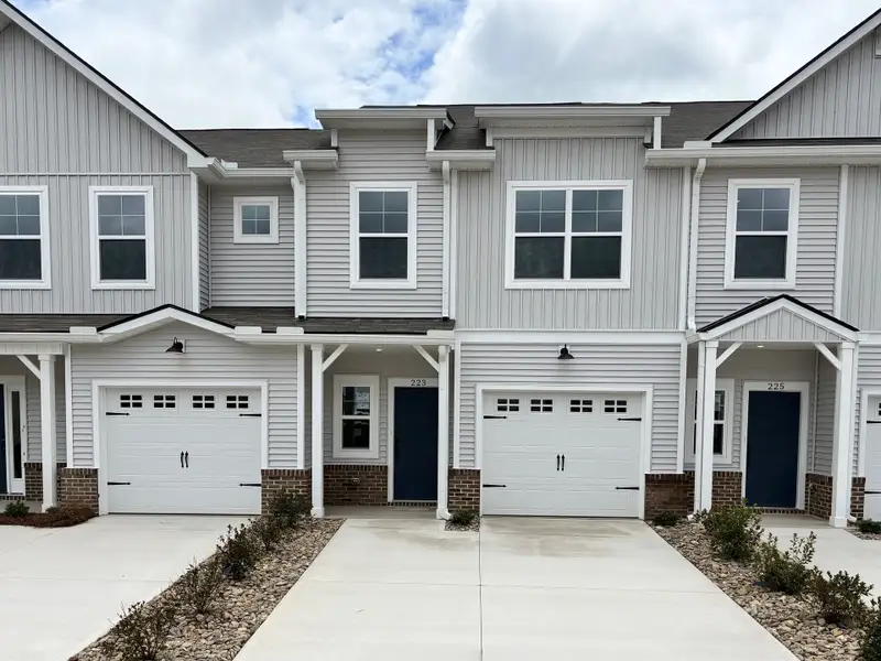 Front exterior of a new home in Holly Ridge, Greenville, SC, highlighting curb appeal (Image 1).