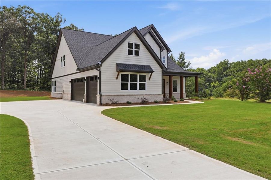 Front exterior of a new home in , Lula, GA, highlighting curb appeal (Image 2). Front exterior of a new home in , Lula, GA, highlighting curb appeal (Image 2).