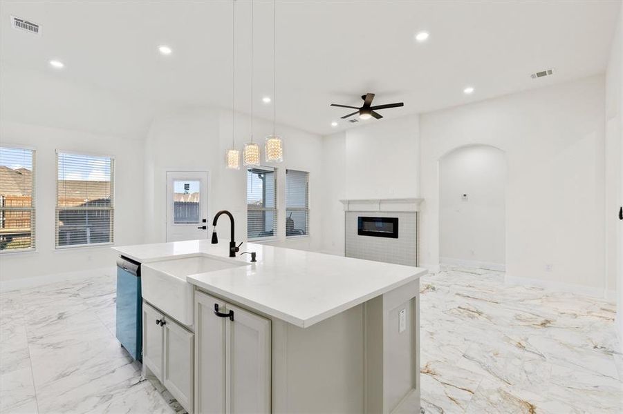 Kitchen with recessed lighting, marble finish floor, visible vents, and dishwasher Kitchen with recessed lighting, marble finish floor, visible vents, and dishwasher