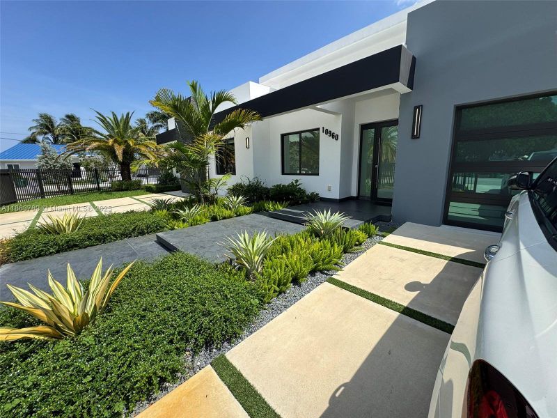 Front exterior of a new home in , Miami, FL, highlighting curb appeal (Image 23).