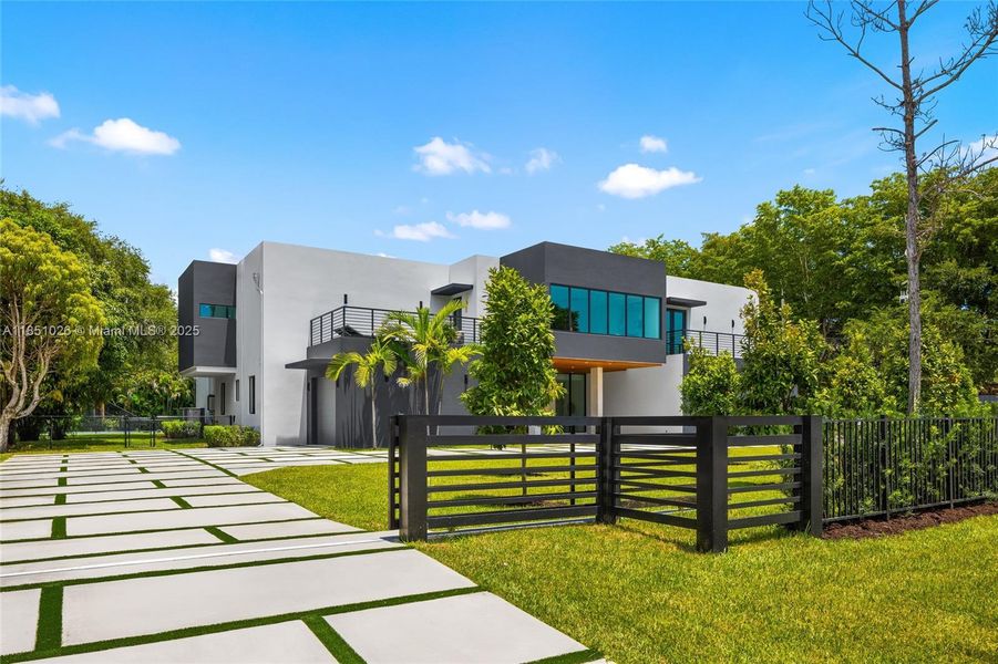 Front exterior of a new home in , Pinecrest, FL, highlighting curb appeal (Image 26).