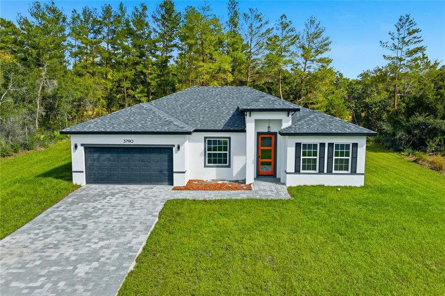 Front exterior of a new home in , Ocala, FL, highlighting curb appeal (Image 1).