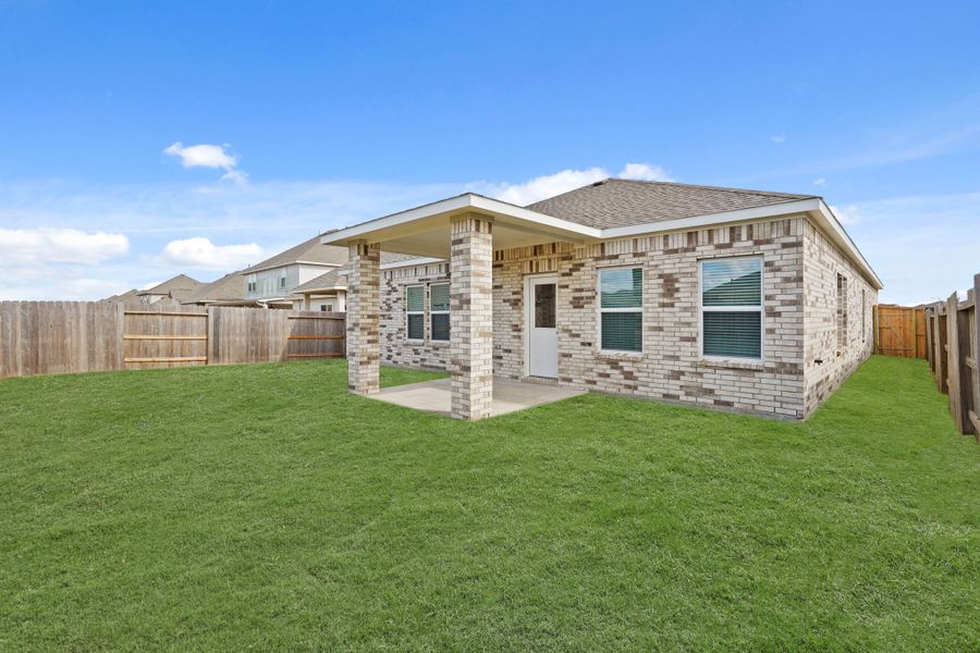 A house with a fence around it. A house with a fence around it.