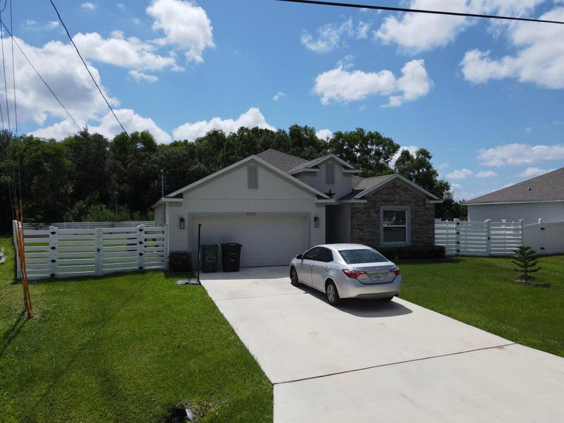 Front exterior of a new home in , Port St. Lucie, FL, highlighting curb appeal (Image 27).