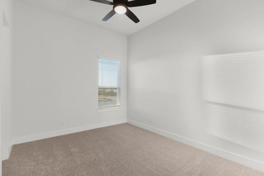 Representative unfurnished interior of a home built from the Merritt by Chesmar Homes in Feathergrass, Fulshear (Image 13).