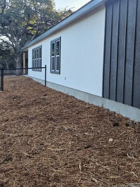 Exterior details and patio area of a home in , Spring Branch (Image 1).