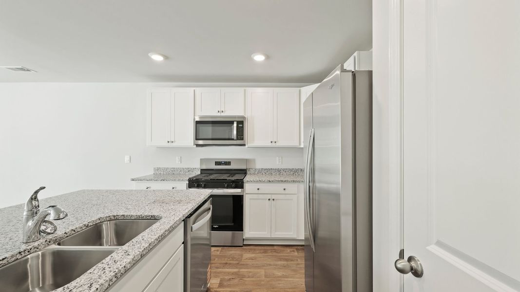 Furnished interior view inside a new home in Pine Hills Townhomes at Cane Bay, Summerville (Image 4).
