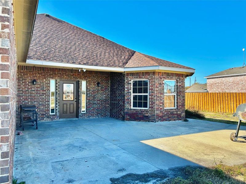 Rear view of house with a patio area