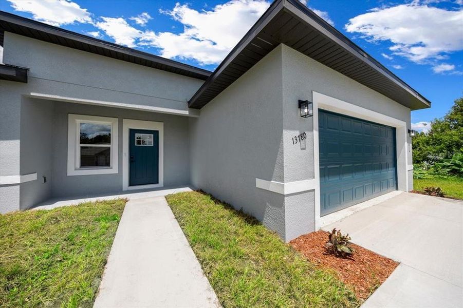 Front exterior of a new home in , Ocala, FL, highlighting curb appeal (Image 1). Front exterior of a new home in , Ocala, FL, highlighting curb appeal (Image 1).