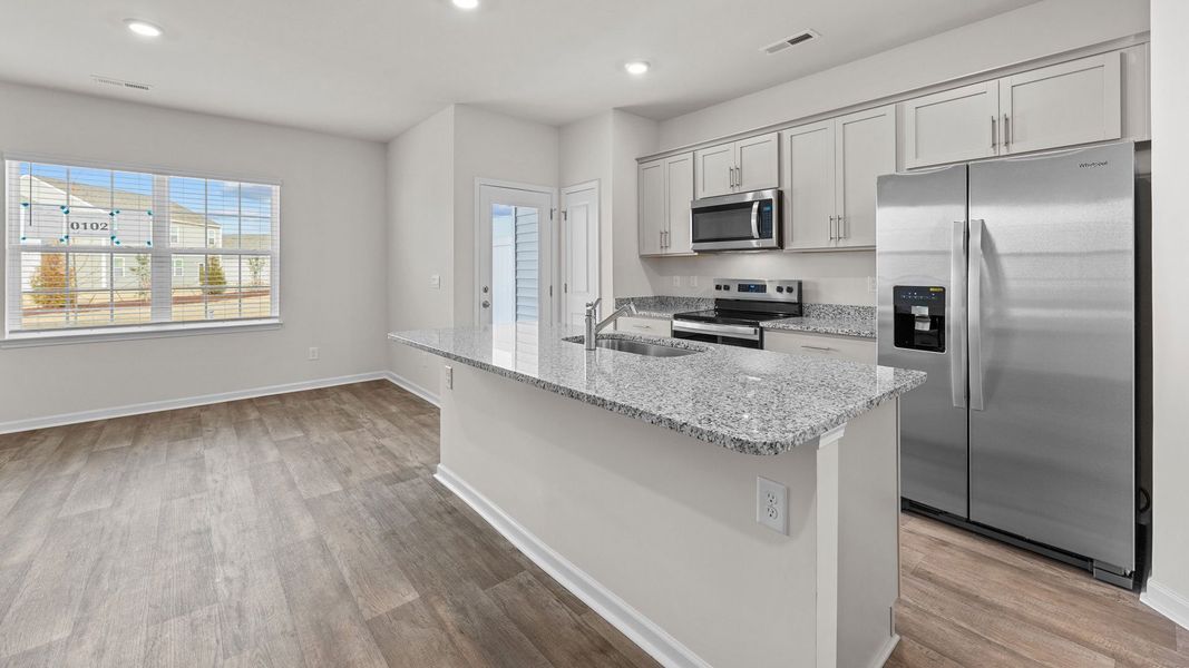 Furnished interior view inside a new home in The Townes at Ridgewood Farms, Winterville (Image 4).