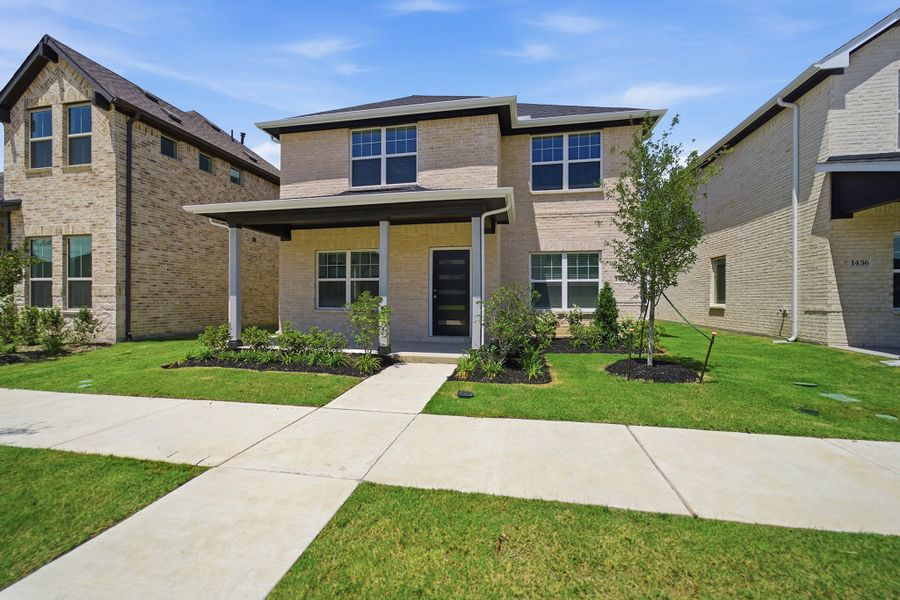 Front exterior of a new home in La Terra, Celina, TX, highlighting curb appeal (Image 2). Front exterior of a new home in La Terra, Celina, TX, highlighting curb appeal (Image 2).