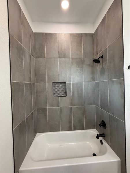 Bathroom featuring bathing tub / shower combination