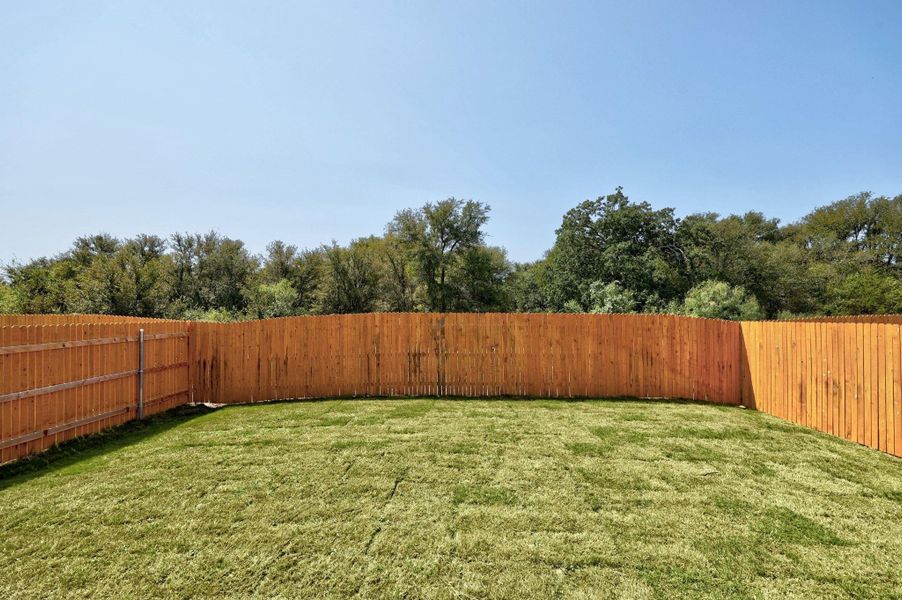 Front exterior of a new home in Trinity Ranch, Elgin, TX, highlighting curb appeal (Image 22).