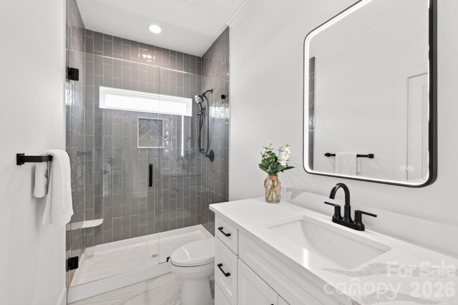 Secondary full bath on the upper level