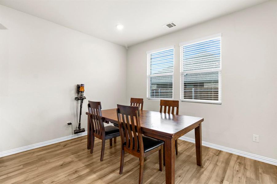 Dining space featuring light wood-style floors and recessed lighting Dining space featuring light wood-style floors and recessed lighting