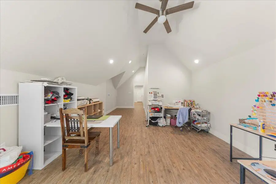 Game room with wood finished floors and lofted ceiling Game room with wood finished floors and lofted ceiling