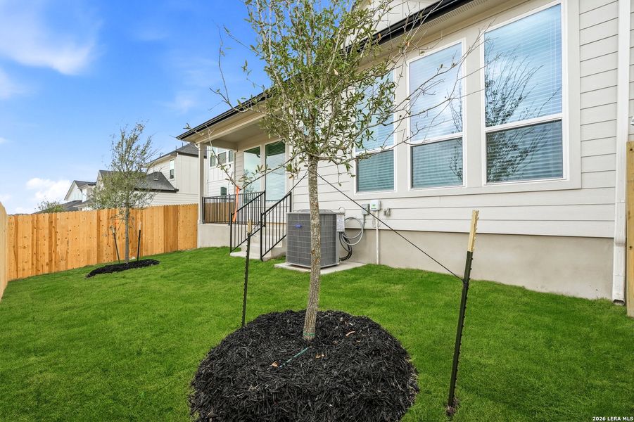 Exterior details and patio area of a home in Prominence, San Antonio (Image 26).