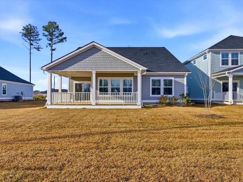 Exterior details and patio area of a home in The Coves at Lakes of Cane Bay, Summerville (Image 28).