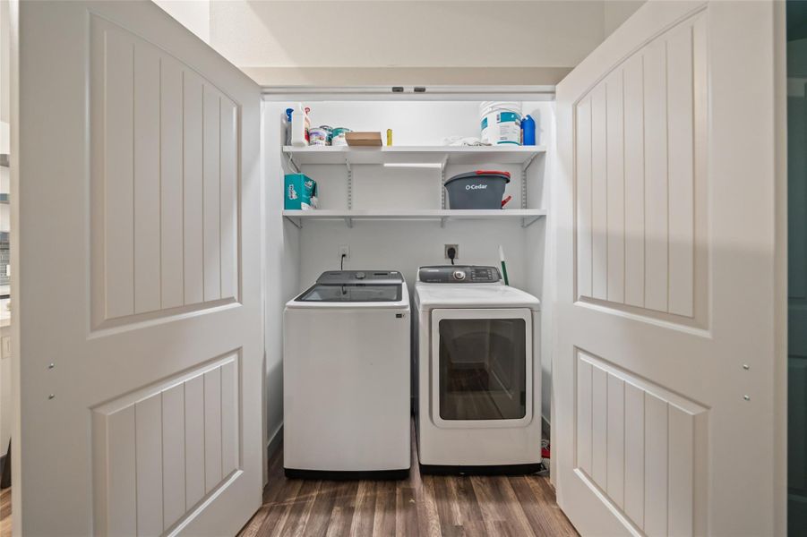 Deep laundry room equipped with double doors for easy access