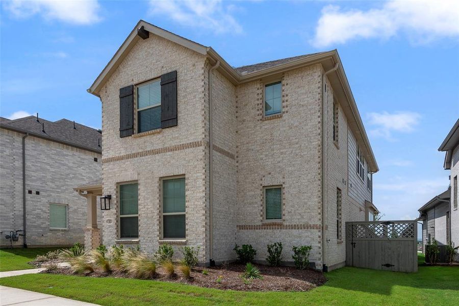 Front exterior of a new home in Pecan Square, Northlake, TX, highlighting curb appeal (Image 26). Front exterior of a new home in Pecan Square, Northlake, TX, highlighting curb appeal (Image 26).