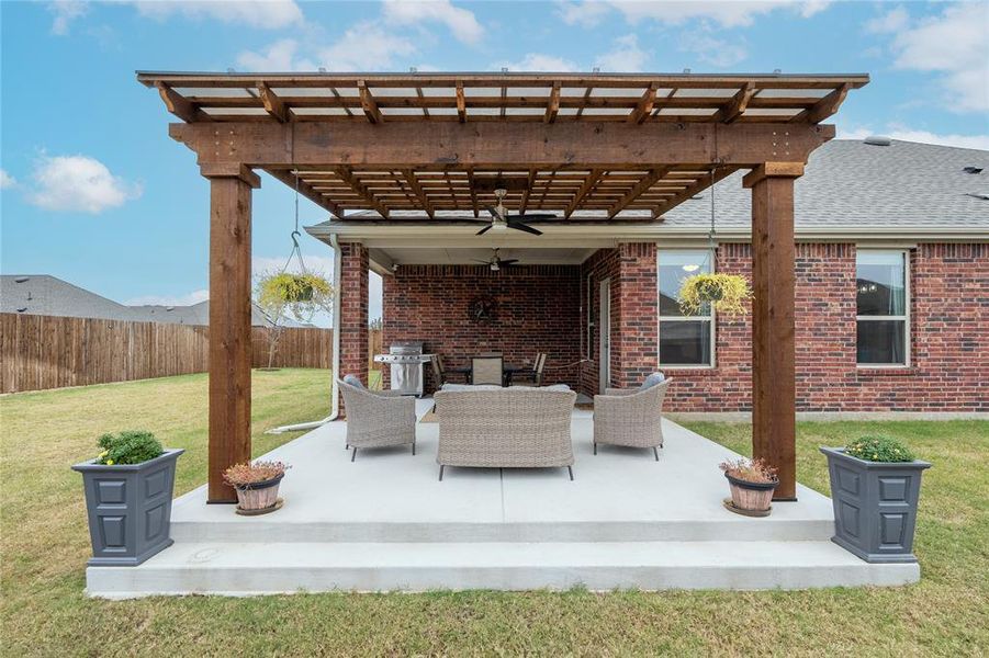 View of patio / terrace with ceiling fan, a grill, and a pergola