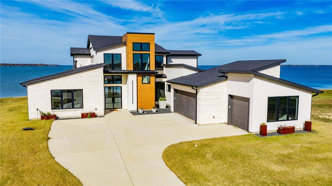 Front exterior of a new home in , Gun Barrel City, TX, highlighting curb appeal (Image 1). Front exterior of a new home in , Gun Barrel City, TX, highlighting curb appeal (Image 1).