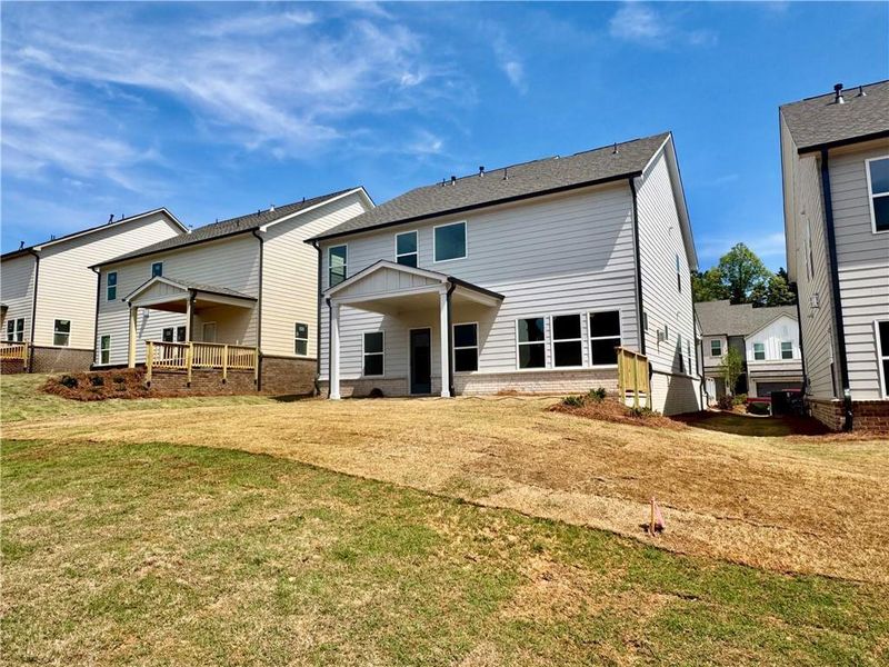 Exterior details and patio area of a home in Eastlyn Crossing, Flowery Branch (Image 3).