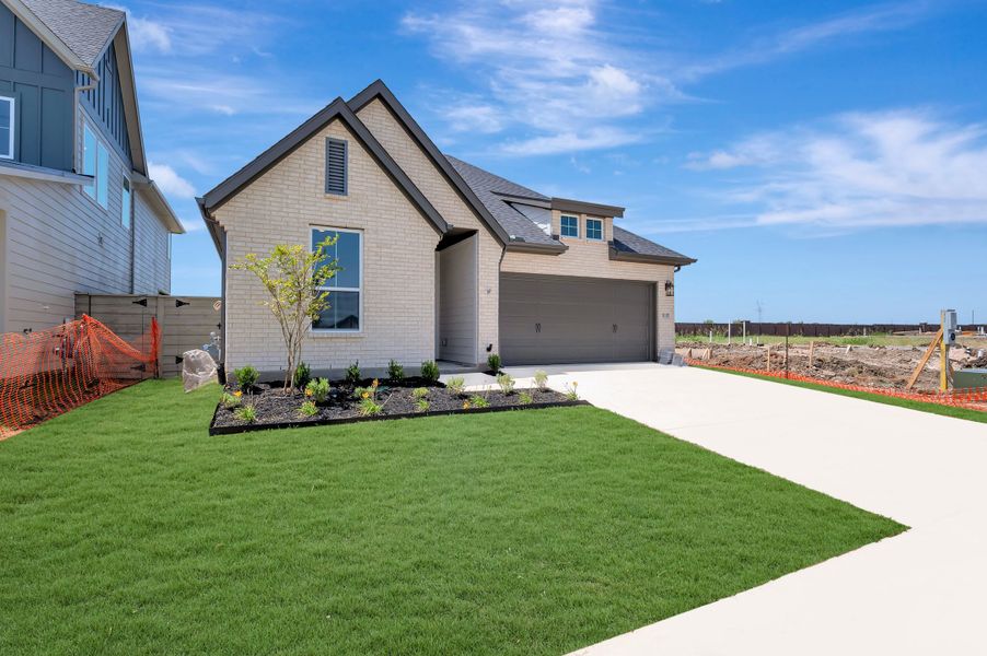 Front exterior of a new home in Landmark, Denton, TX, highlighting curb appeal (Image 2). Front exterior of a new home in Landmark, Denton, TX, highlighting curb appeal (Image 2).