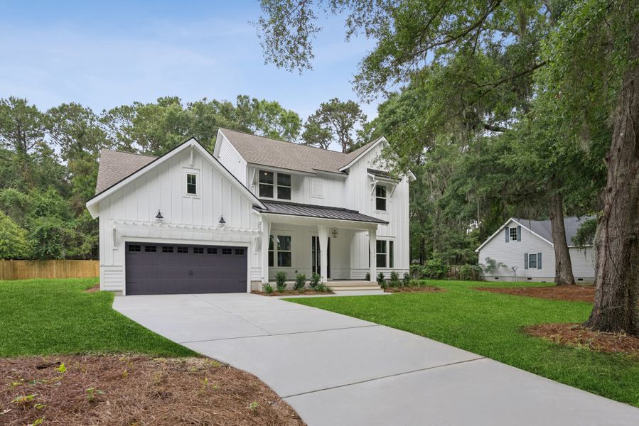 Front exterior of a new home in Discover Series - Signature, Johns Island, SC, highlighting curb appeal (Image 26). Front exterior of a new home in Discover Series - Signature, Johns Island, SC, highlighting curb appeal (Image 26).