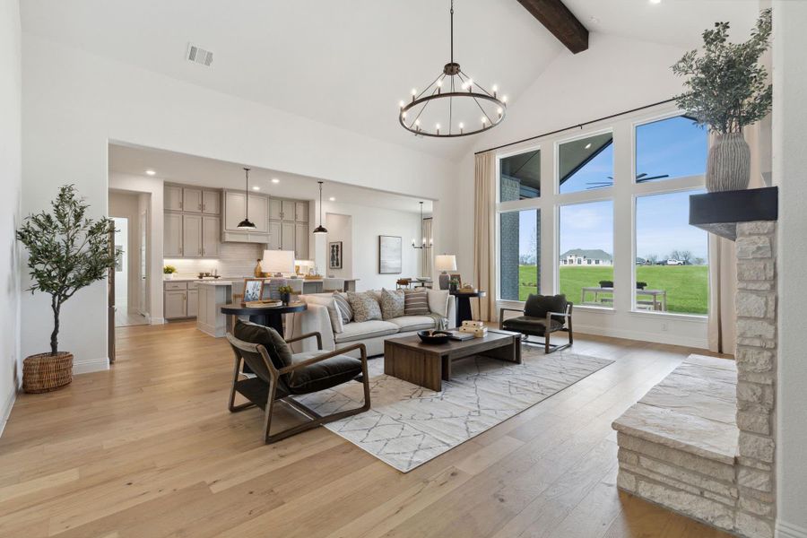 Family Room & Kitchen | Concept 3441 at Hidden Creek Estates in Van Alstyne, TX by Landsea Homes