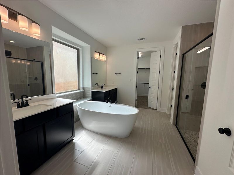 Primary Bath retreat with dual vanities and soaking tub