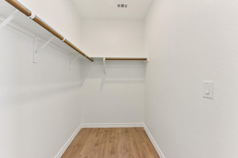 Walk in closet featuring light wood finished floors