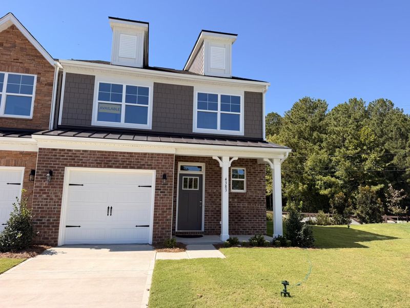 Front exterior of a new home in Harrisburg Village Townhomes, Harrisburg, NC, highlighting curb appeal (Image 1). Front exterior of a new home in Harrisburg Village Townhomes, Harrisburg, NC, highlighting curb appeal (Image 1).