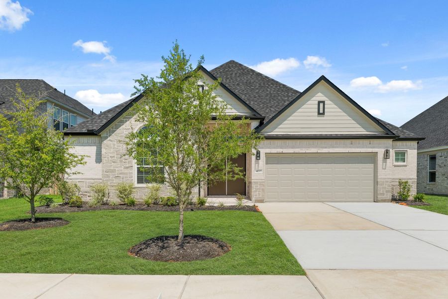Front exterior of a new home in Briarwood Crossing, Rosenberg, TX, highlighting curb appeal (Image 13).