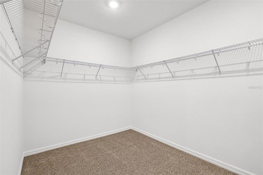 Spacious, unfurnished interior of a new home in The Grove at Stuart Crossing - Signature Series, Bartow (Image 14).