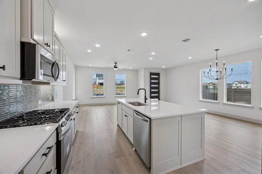 The chef in the family will never be left out of the party in this dream home!