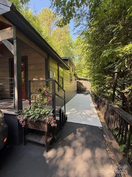 Side view to the back porch area and back of home