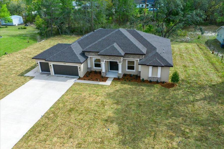 Front exterior of a new home in , Weeki Wachee, FL, highlighting curb appeal (Image 34).
